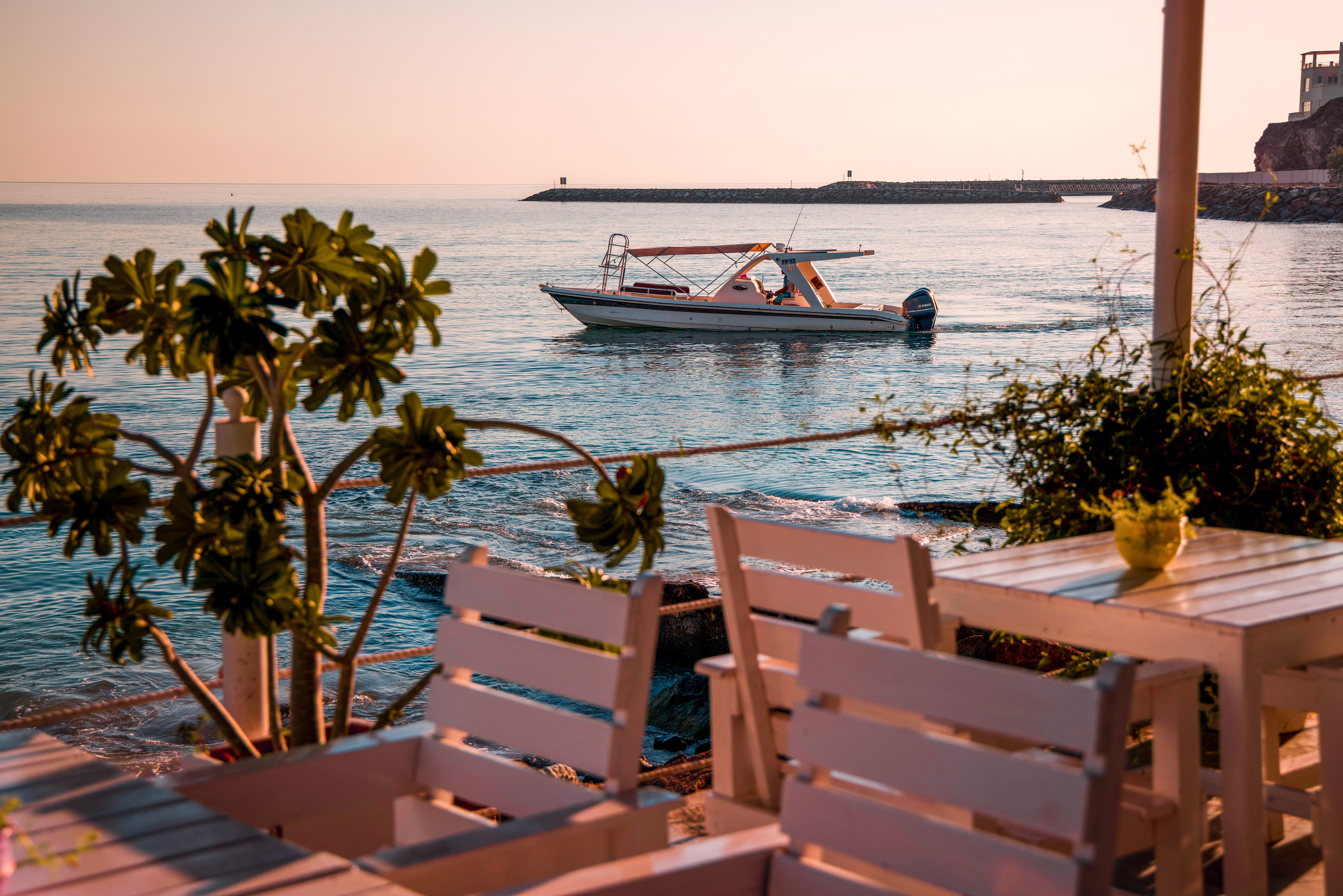 Sunset terrace view with boat in Dibba Fujairah